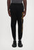 TRAIN LOGO SERIES PANTS - Pantalon de survêtement - black/gold coloured