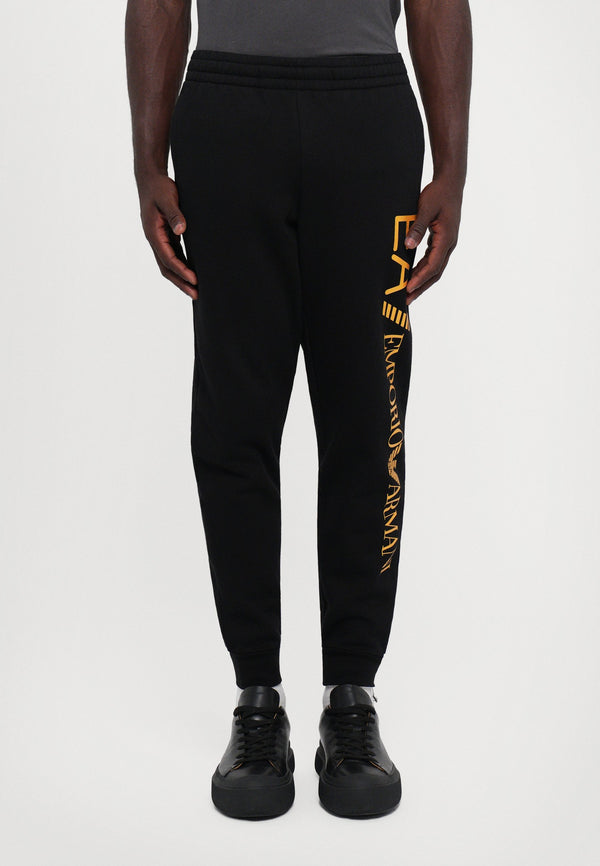 TRAIN LOGO SERIES PANTS - Pantalon de survêtement - black/gold coloured
